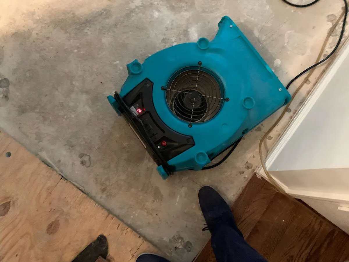 Air mover drying subfloor during Leak Detection & Repair in Lebanon